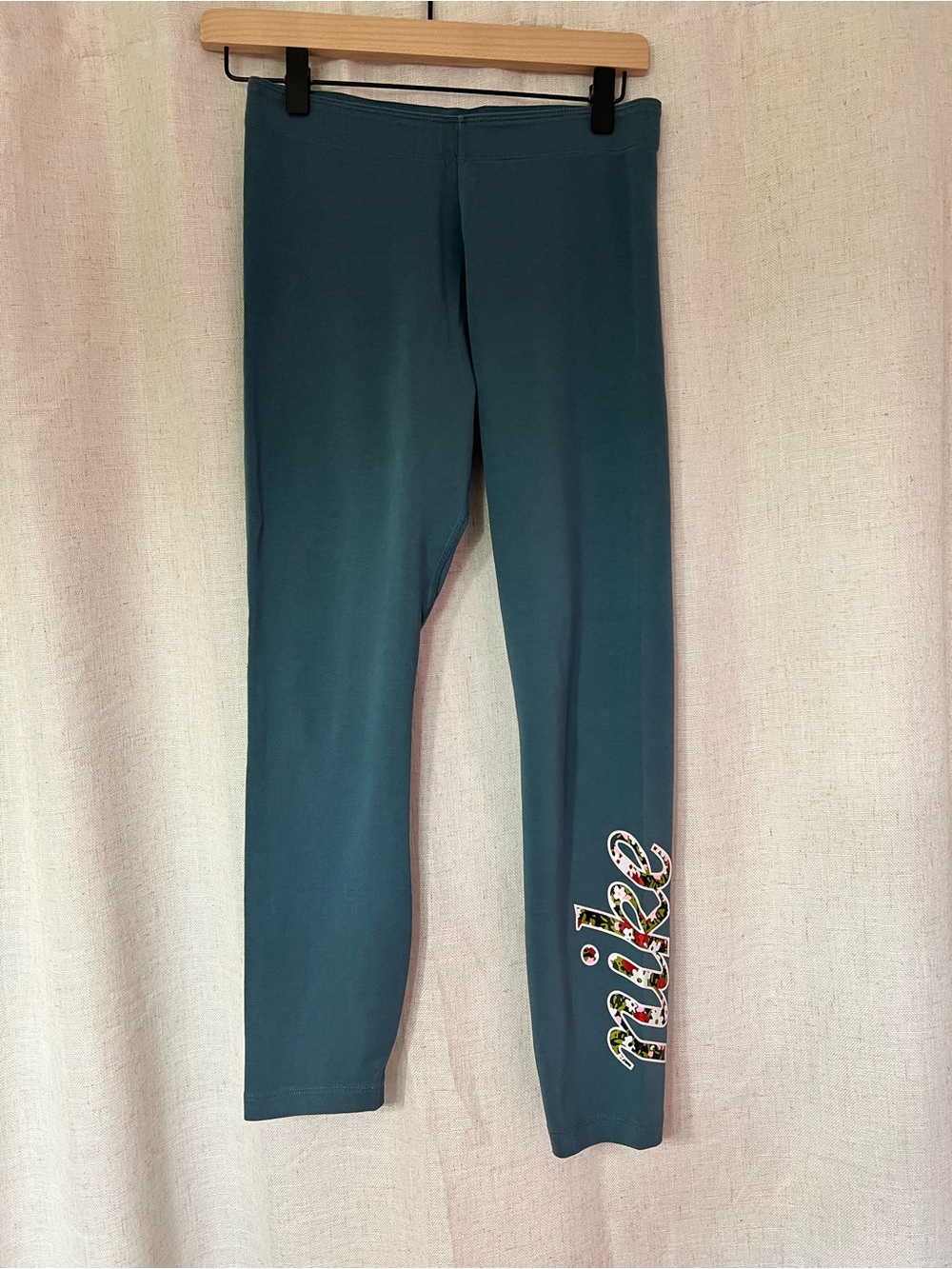 Nike Teal Leggings with Floral Script Logo on Lower Leg